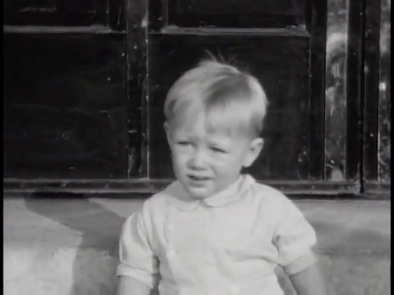 Original frame from the same 1938 film, soft and faded