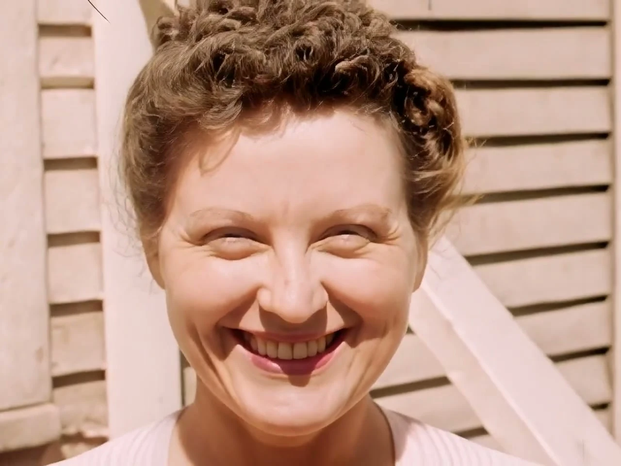 A restored face, sharp and detailed, in color