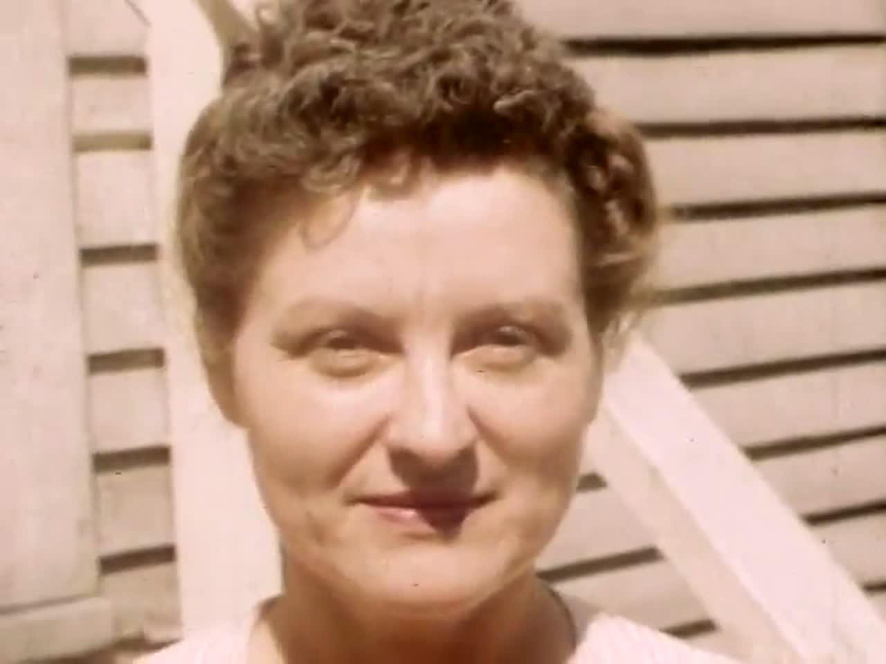 The same face before restoration, soft and faded