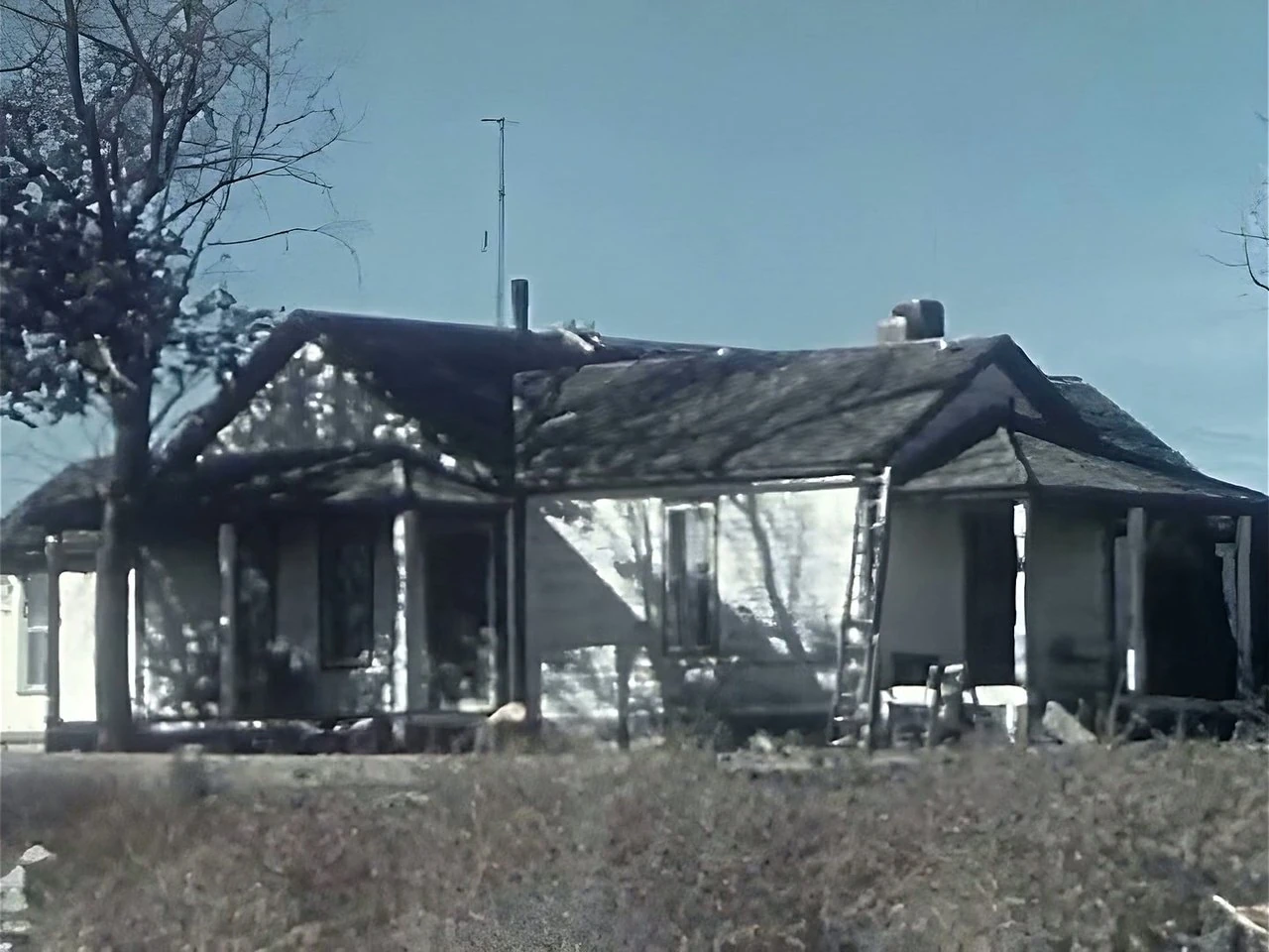 A farmhouse from a 1950s colour film, restored: crisp boards, clean sky